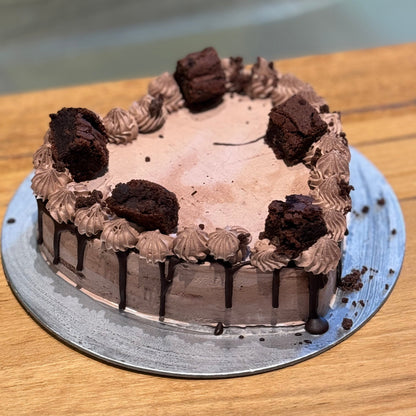 Full view of a heart-shaped chocolate fudge brownie cake handcrafted in Adelaide using Ben & Jerry's ice cream, featuring an indulgent chocolate design.