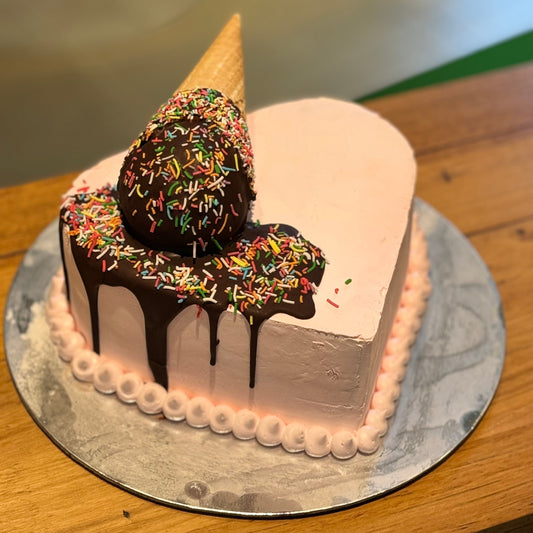 Full view of a heart-shaped melting cone birthday cake handcrafted in Adelaide using Ben & Jerry's ice cream, featuring a playful ice cream-inspired design.