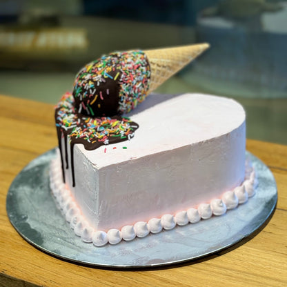 Side view of a handcrafted heart-shaped melting cone cake made using Ben & Jerry's ice cream in Adelaide, highlighting its romantic shape and whimsical styling.