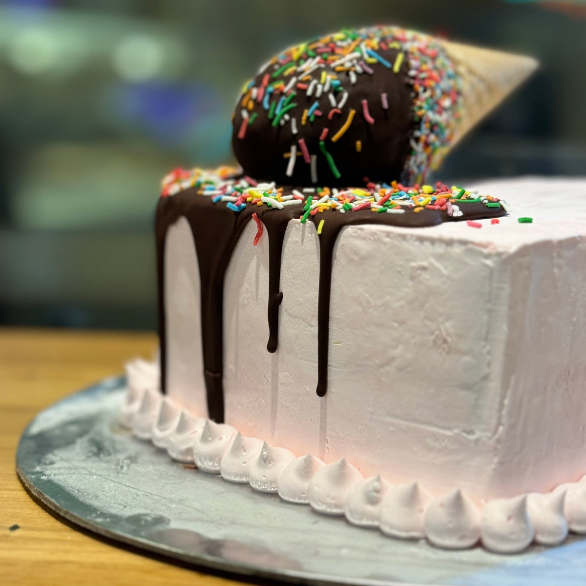 close up of a heart-shaped birthday cake made with Ben & Jerry's ice cream in Adelaide, showcasing its distinctive melting cone decoration.