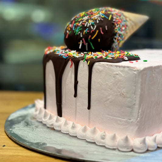 close up of a heart-shaped birthday cake made with Ben & Jerry's ice cream in Adelaide, showcasing its distinctive melting cone decoration.