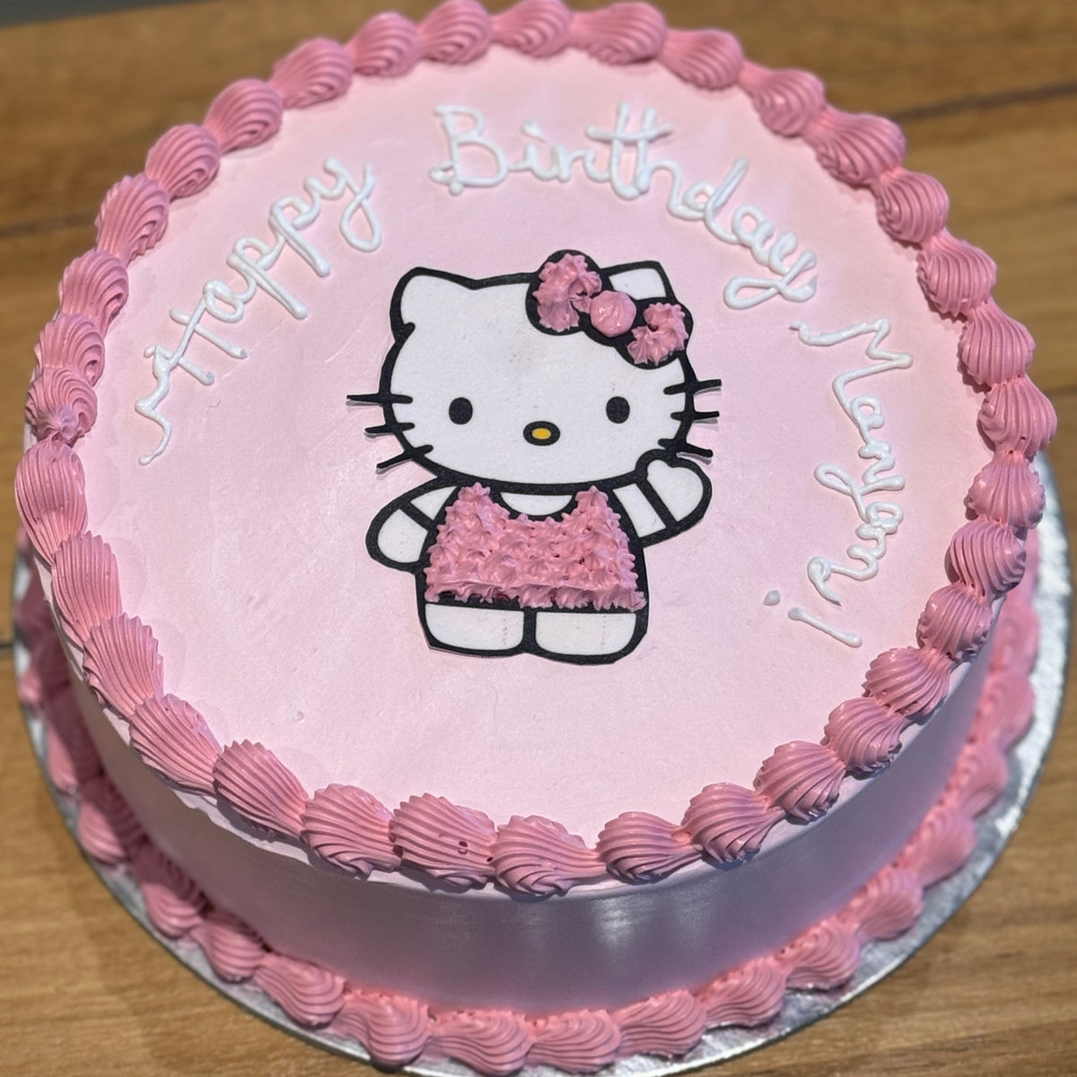 top view of a Hello Kitty birthday cake handcrafted in Adelaide using Ben & Jerry's ice cream, featuring an adorable Sanrio-inspired design.