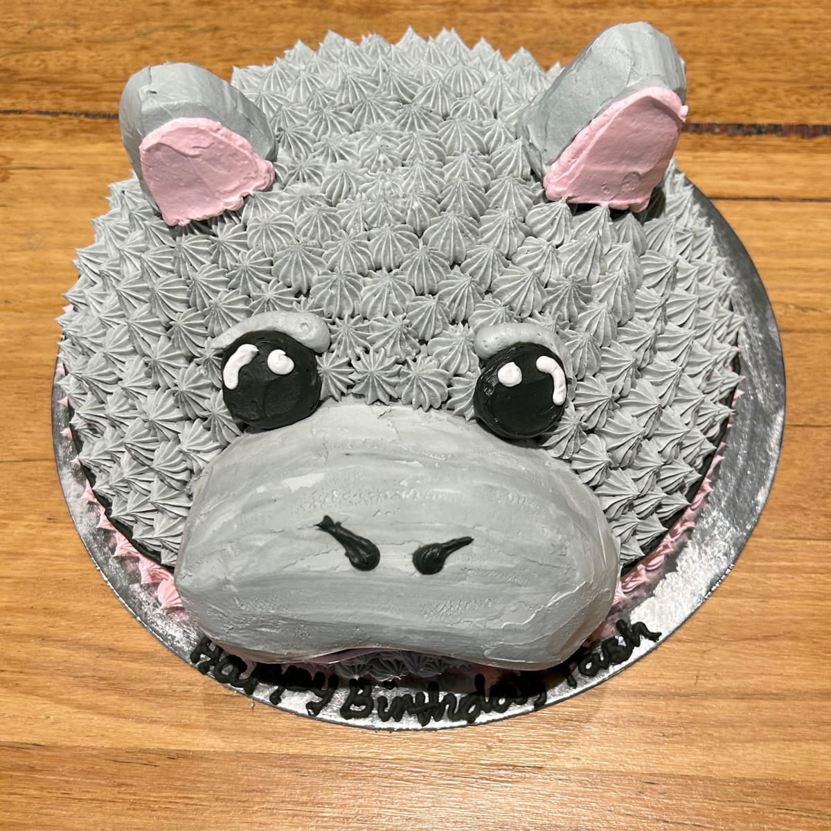 top view of a hippo-themed dome cake made with Ben & Jerry's ice cream in Adelaide, showcasing its playful hippopotamus face.