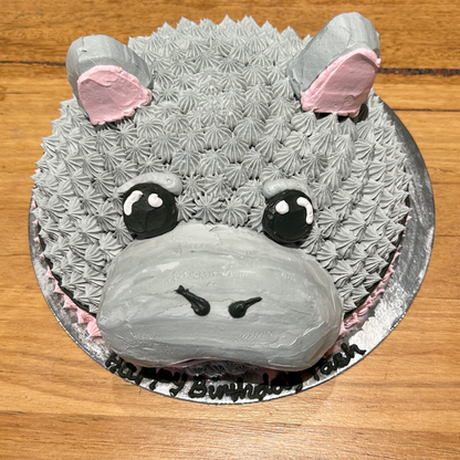 top view of a hippo-themed dome cake made with Ben & Jerry's ice cream in Adelaide, showcasing its playful hippopotamus face.