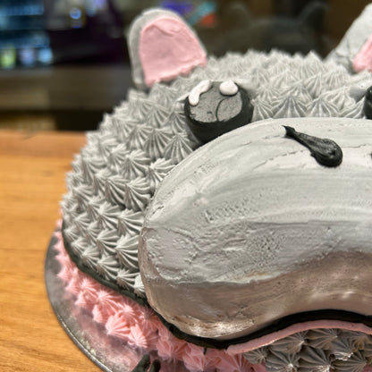 Side view of a handcrafted hippo dome ice cream cake in Adelaide made using Ben & Jerry's ice cream, highlighting its rounded three-dimensional shape.