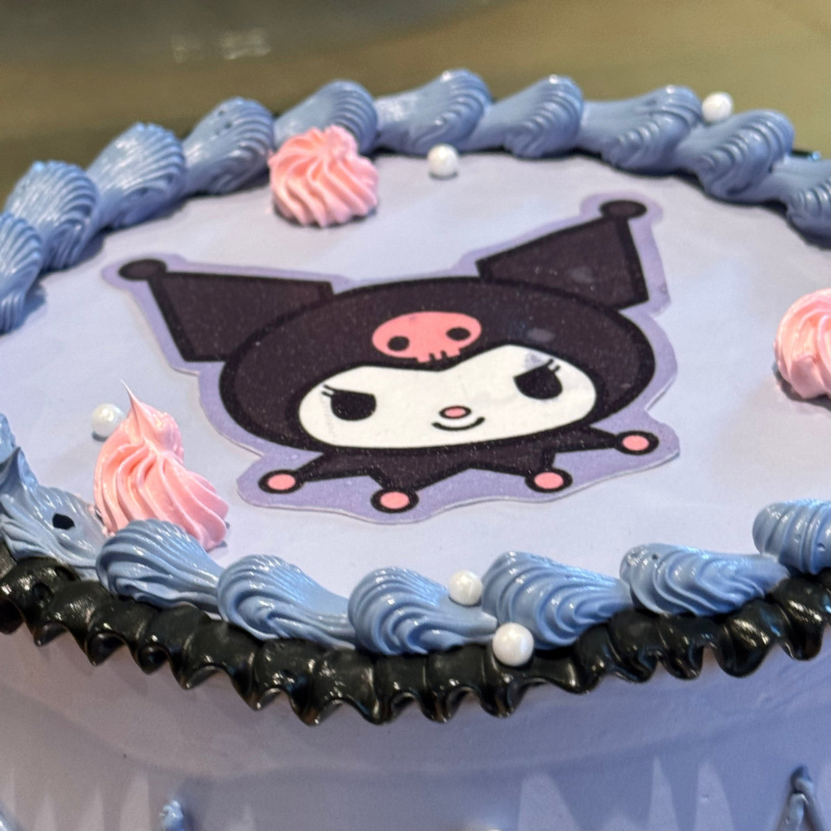 Sanrio Kuromi and Hello Kitty Inspired Ice Cream Cake featuring playful pastel and dark contrasts for kids celebrations across Adelaide