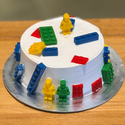 Full view of a LEGO-inspired birthday cake handcrafted in Adelaide using Ben & Jerry's ice cream, featuring a colourful building brick theme.