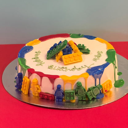 Full view of a LEGO-inspired birthday cake handcrafted in Adelaide using Ben & Jerry's ice cream, featuring colourful building block-themed decorations.