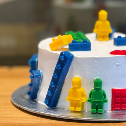 Side view of a handcrafted LEGO birthday ice cream cake in Adelaide made using Ben & Jerry's ice cream, highlighting its colourful brick-themed styling.
