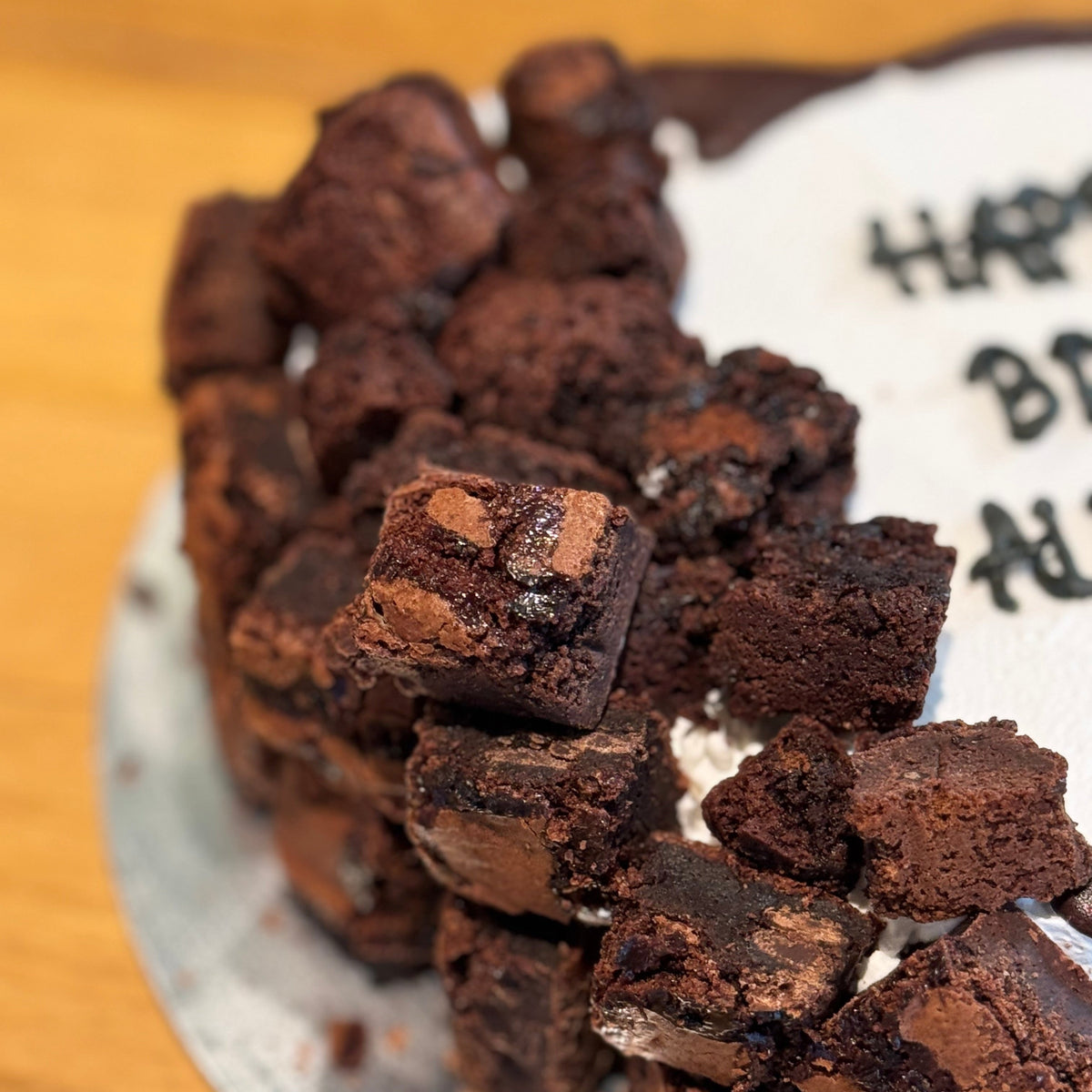 Close-up of the brownie-inspired toppings on a heart-shaped cake made in Adelaide using Ben & Jerry's ice cream.