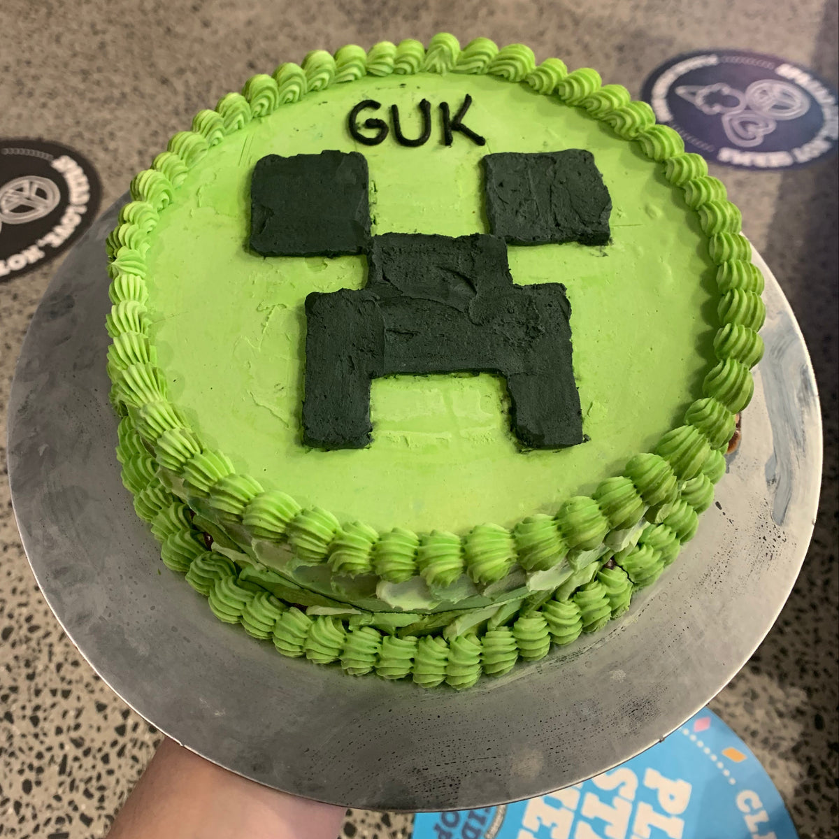 top view of the Minecraft Creeper birthday cake highlighting its pixel-style green design and distinctive Creeper character features.