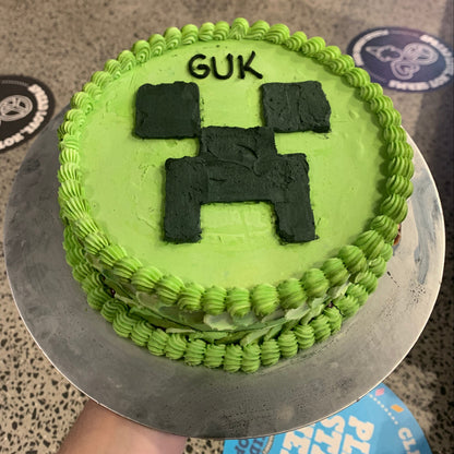 top view of the Minecraft Creeper birthday cake highlighting its pixel-style green design and distinctive Creeper character features.