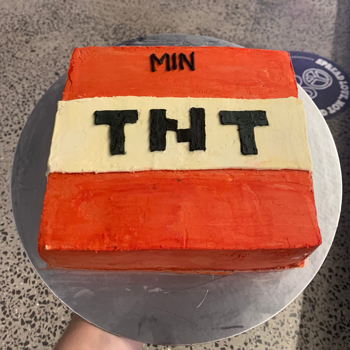 top view of a square Minecraft TNT birthday cake handcrafted in Adelaide using Ben & Jerry's ice cream, featuring the iconic explosive block design.