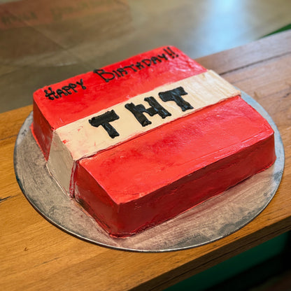 side view of a Minecraft TNT-themed birthday cake made with Ben & Jerry's ice cream in Adelaide, showcasing its recognisable pixel-inspired TNT block styling.