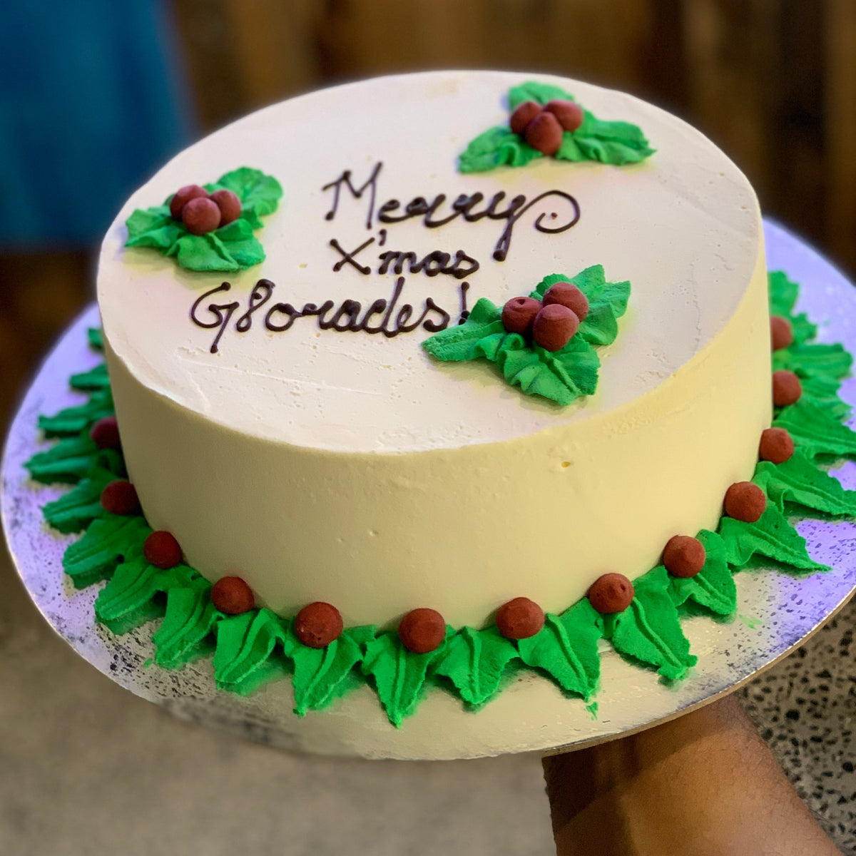 Full view of a festive mistletoe Christmas cake handcrafted in Adelaide using Ben & Jerry's ice cream, featuring an elegant botanical holiday theme.