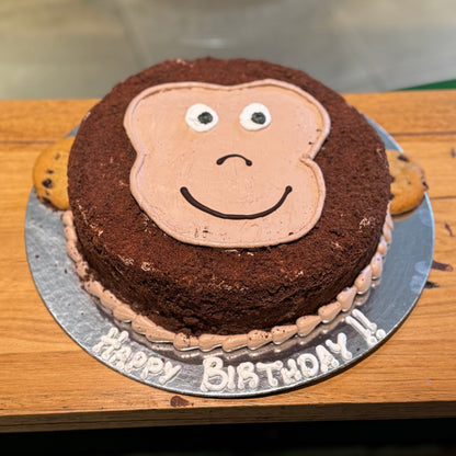 Full view of a cute monkey face birthday cake handcrafted in Adelaide using Ben & Jerry's ice cream, featuring a playful jungle animal design.