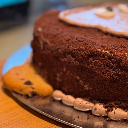 Close-up of the cute monkey facial details on a birthday cake handcrafted in Adelaide using Ben & Jerry's ice cream.