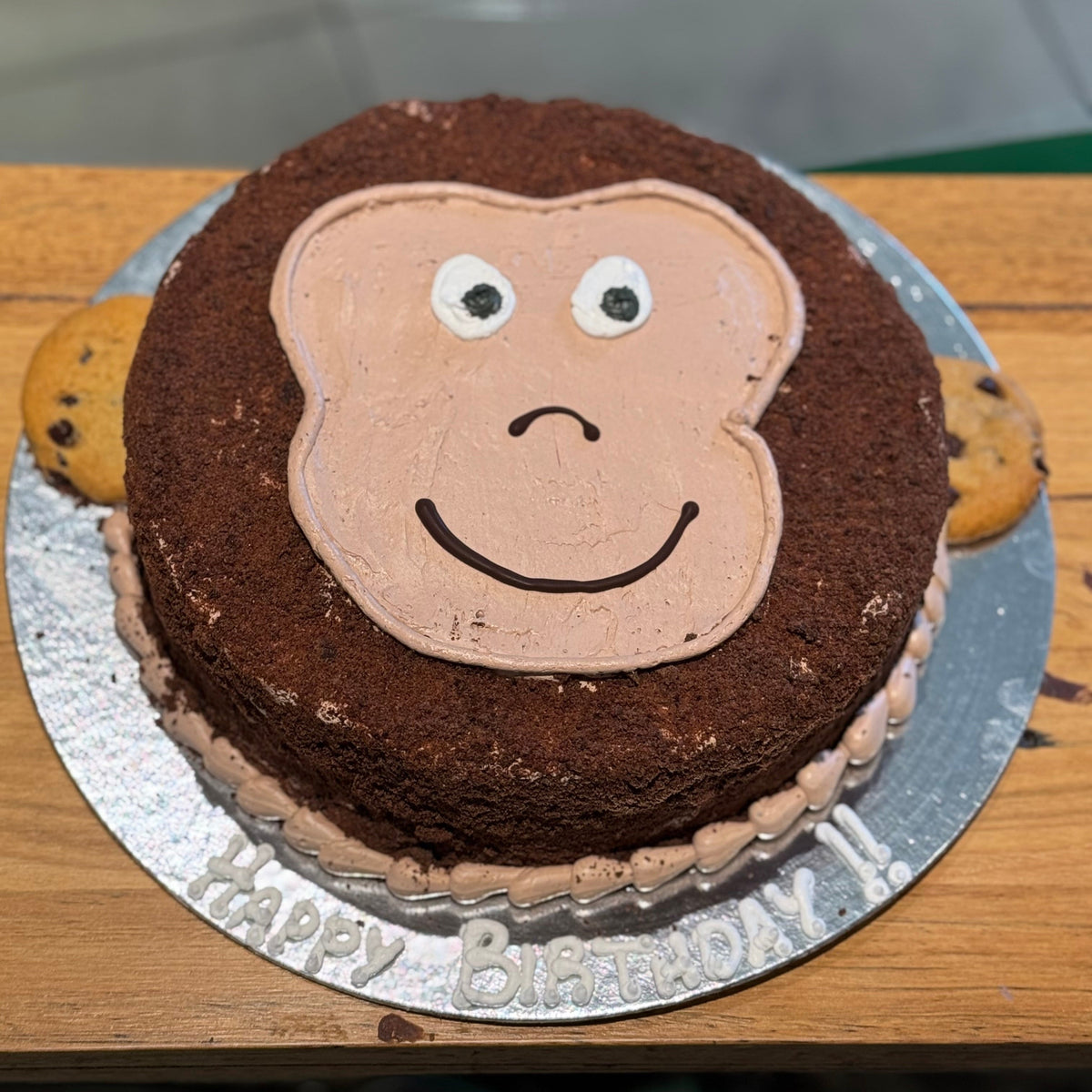 top view of a monkey-themed cake made with Ben & Jerry's ice cream in Adelaide, showcasing its adorable facial decorations.