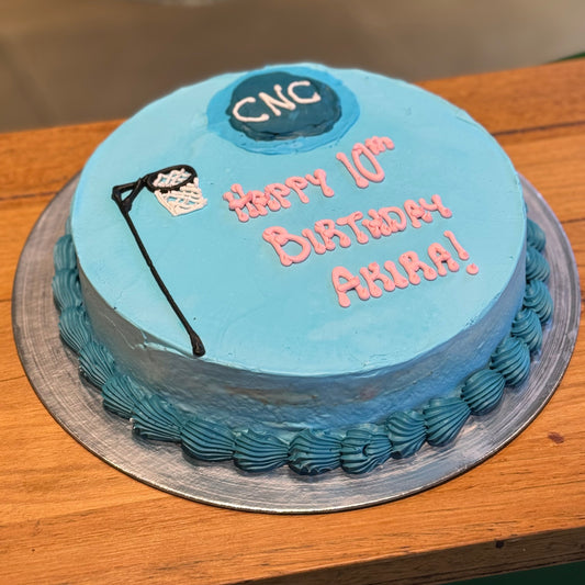 Full view of a netball-themed birthday cake handcrafted in Adelaide using Ben & Jerry's ice cream, featuring sporty celebration decorations.