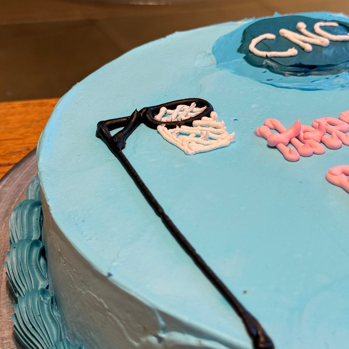 close up of a netball birthday cake made with Ben & Jerry's ice cream in Adelaide, showcasing its netball-inspired design.