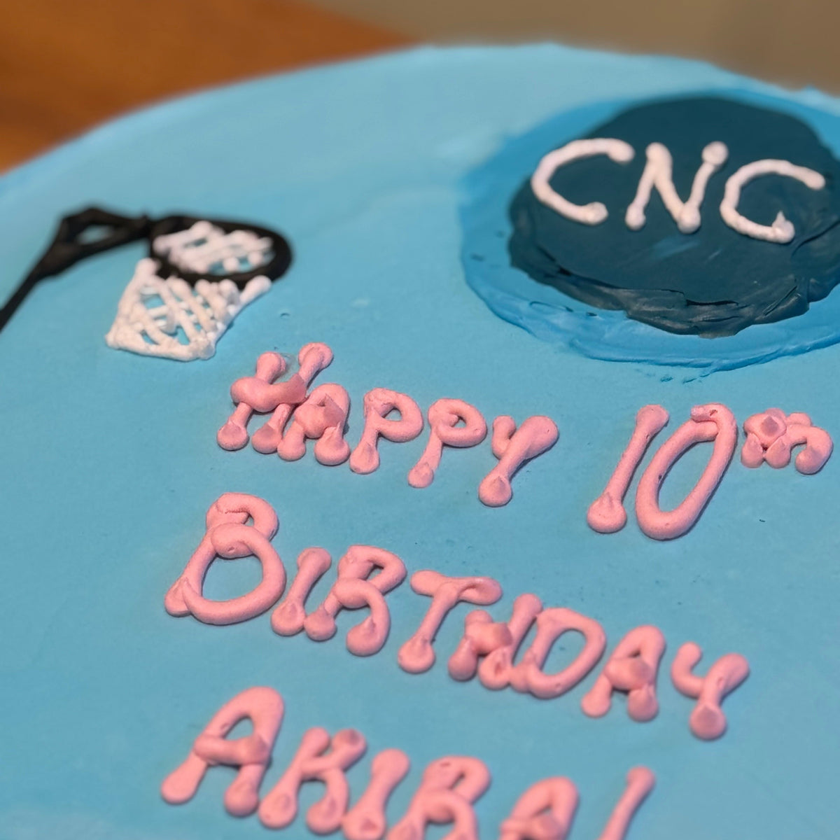 close up of a handcrafted netball ice cream cake in Adelaide made using Ben & Jerry's ice cream, highlighting its sports-themed styling.