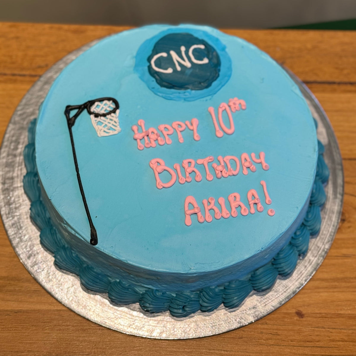 top view of the netball-inspired decorations on a birthday cake handcrafted in Adelaide using Ben & Jerry's ice cream.
