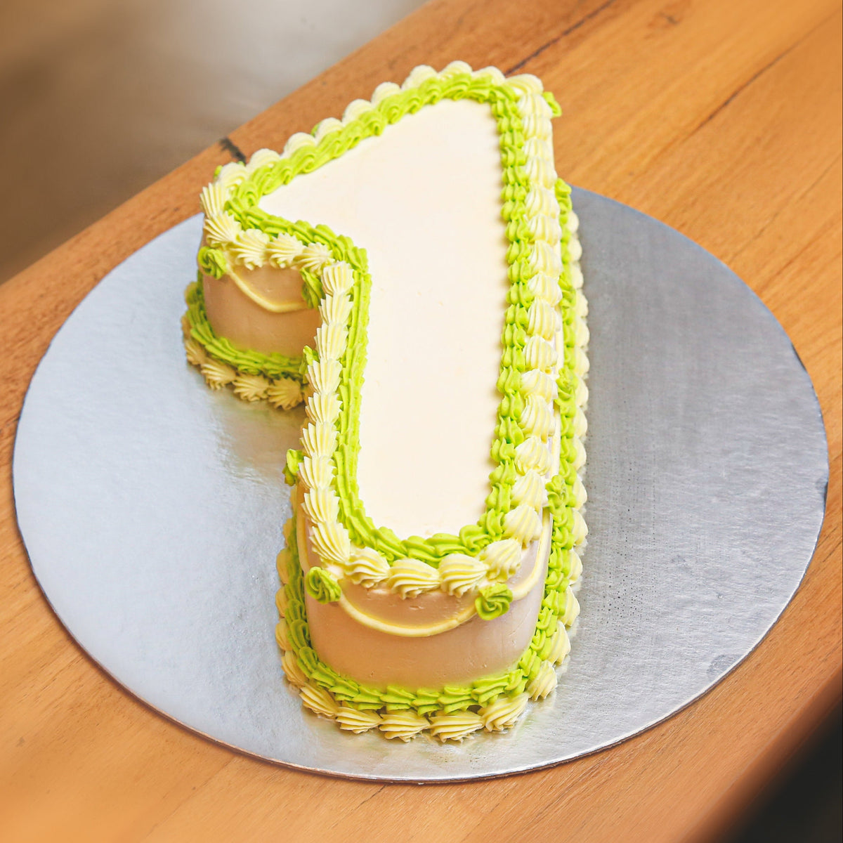 Full view of a handcrafted number 1-shaped ice cream cake designed for a first birthday or special milestone celebration.