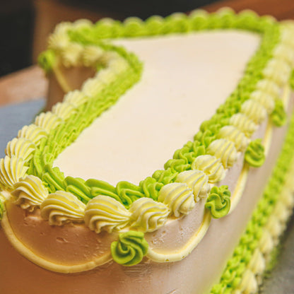 close up of a handcrafted number 1 birthday ice cream cake highlighting its shaped structure and decorative finish.