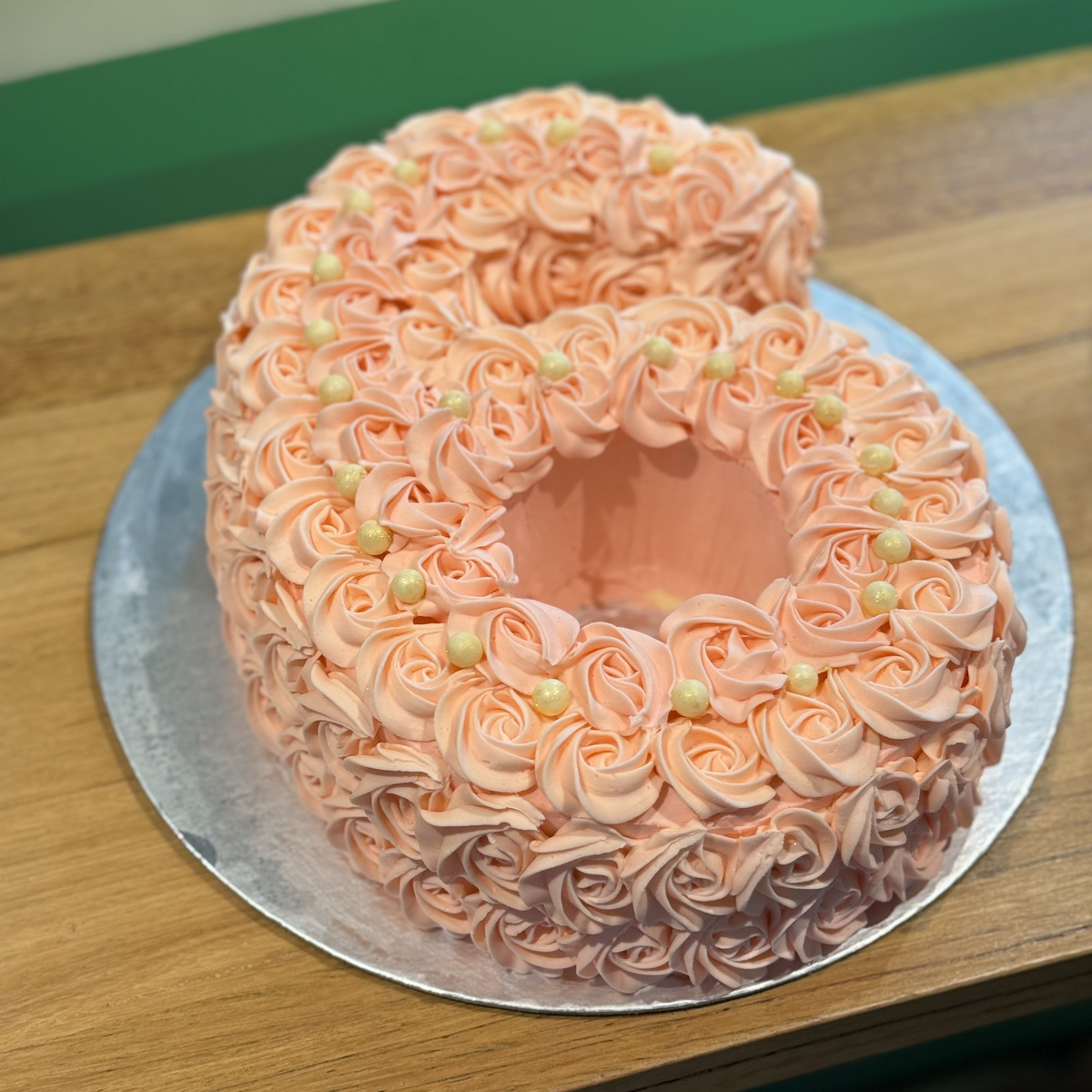 Front view of a number 6 birthday cake made with Ben & Jerry's ice cream in Adelaide, showcasing its playful sixth birthday styling.