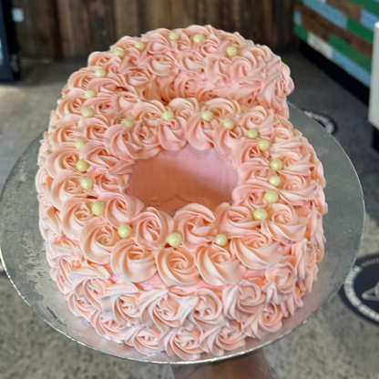 top view of a handcrafted number six ice cream cake in Adelaide made using Ben & Jerry's ice cream, highlighting its unique numeral shape.