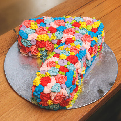 Full view of a handcrafted number 7-shaped birthday ice cream cake designed for a child's seventh birthday celebration.