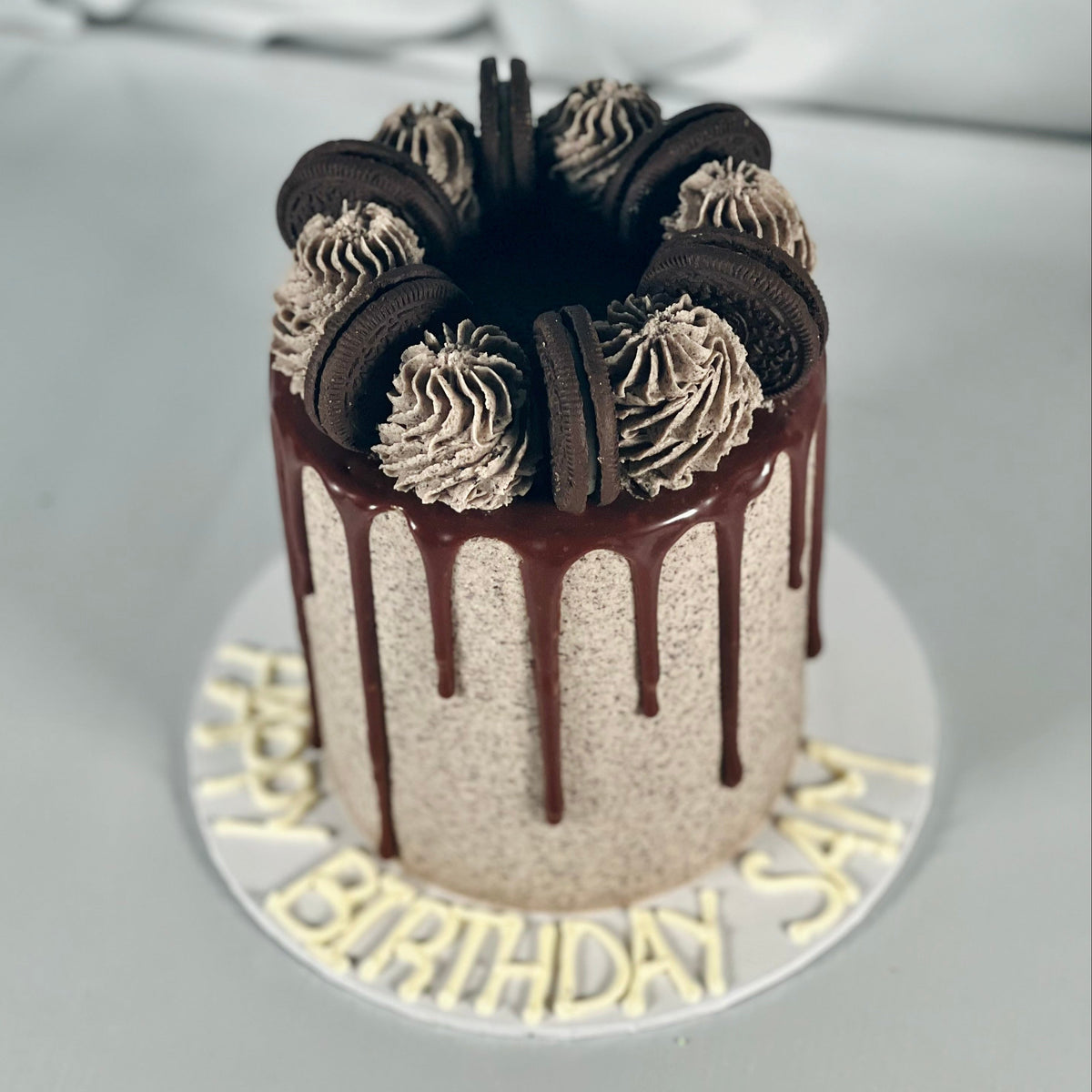 Full view of an Oreo-themed mud or sponge birthday cake handcrafted in Adelaide, featuring chocolate biscuit-inspired decorations.