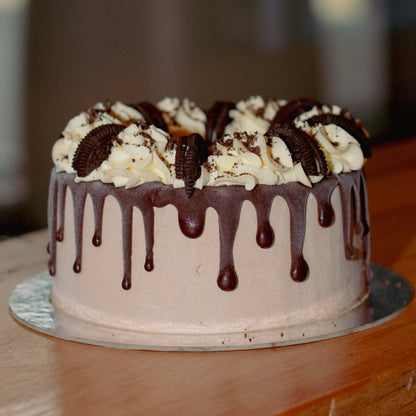 Full view of a chocolate Oreo drip ice cream cake featuring rich chocolate drips and Oreo cookie decorations for birthday celebrations.