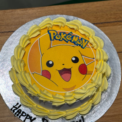 top view of a handcrafted Pikachu birthday cake highlighting its bright yellow colour theme and playful Pokémon-inspired details.