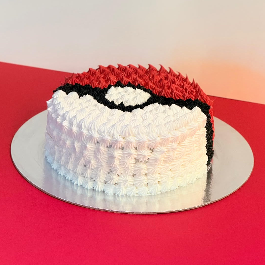 front view of the Pokeball Round Ice Cream Cake handcrafted with Ben & Jerry’s ice cream and personalised details for a Pokémon celebration.
