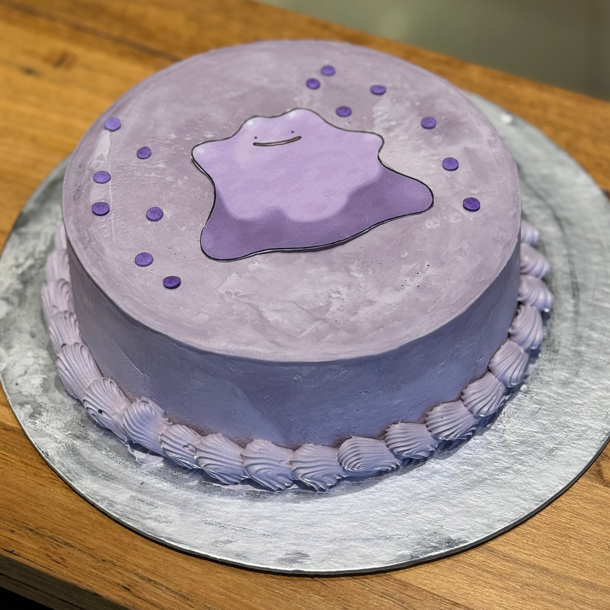 Full view of a purple Pokémon Ditto birthday cake handcrafted in Adelaide using Ben & Jerry's ice cream, featuring its cute character-inspired design.