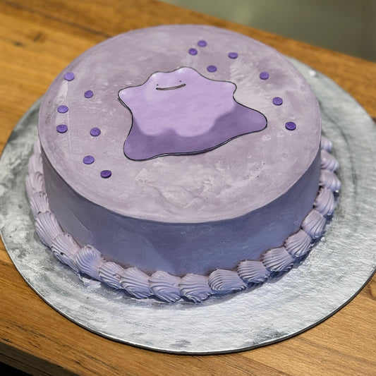 Full view of a purple Pokémon Ditto birthday cake handcrafted in Adelaide using Ben & Jerry's ice cream, featuring its cute character-inspired design.