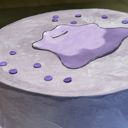 Close-up of the adorable Ditto-inspired facial details on a birthday cake made in Adelaide using Ben & Jerry's ice cream.