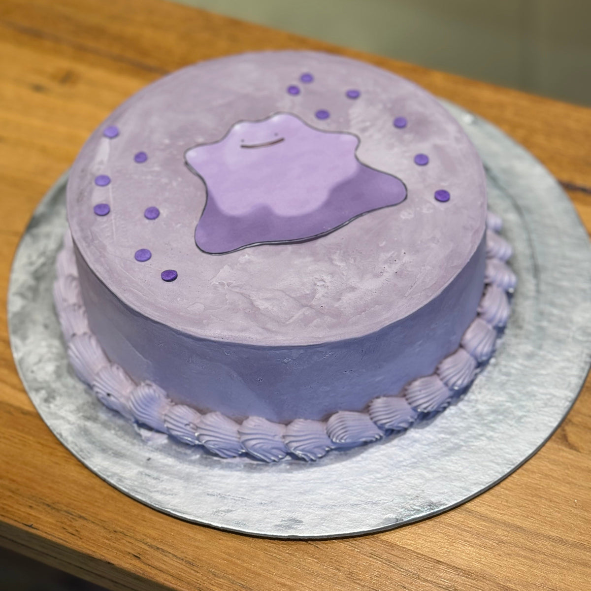 top view of a Pokémon Ditto ice cream cake handcrafted in Adelaide using Ben & Jerry's ice cream, highlighting its playful purple styling.