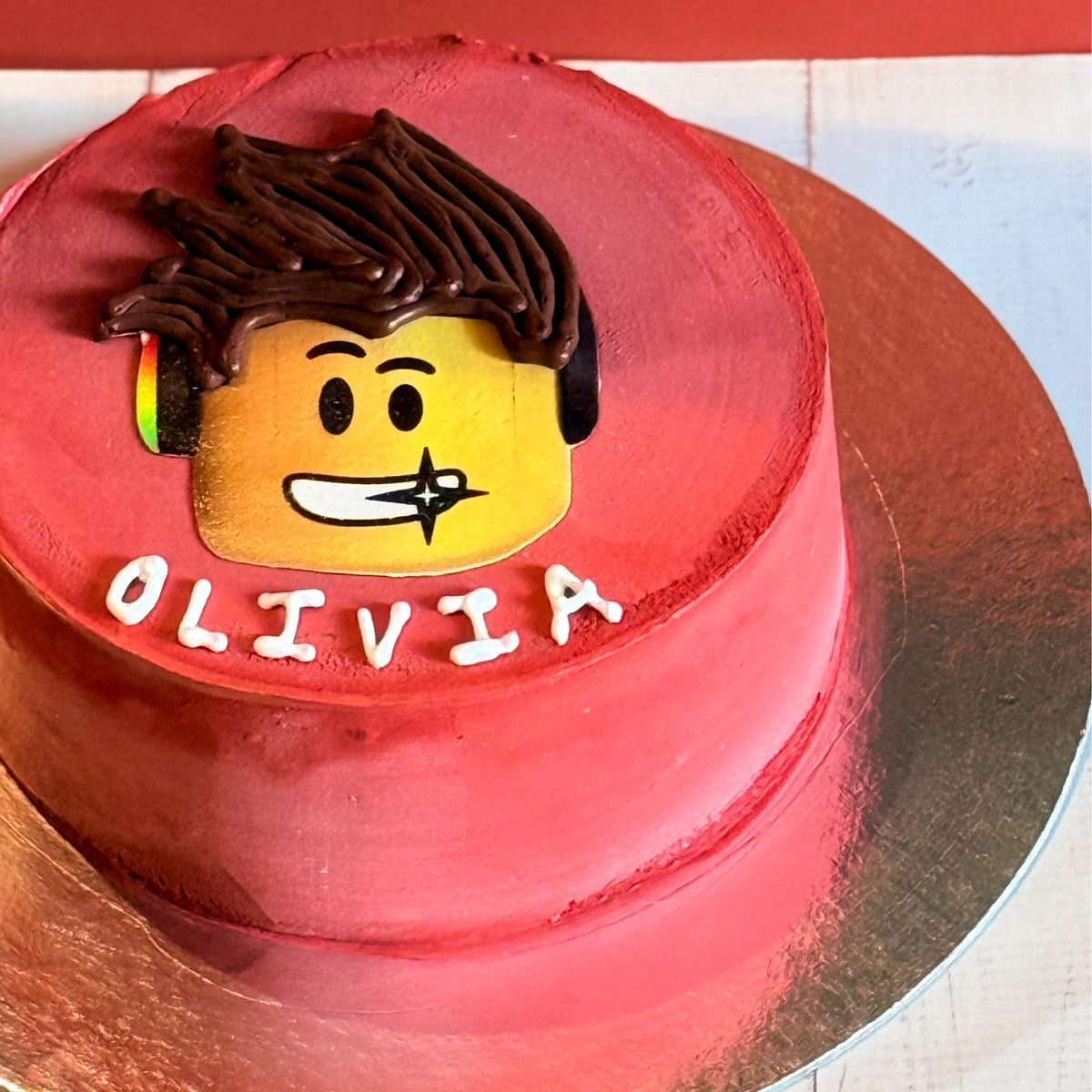 top view of a Roblox-themed birthday cake showcasing playful avatar-inspired decorations for a gaming birthday party.