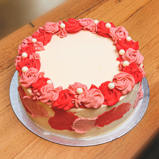 Full view of a Roses and Pearls birthday ice cream cake featuring elegant rose decorations and delicate pearl-inspired accents.