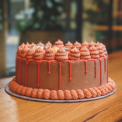 side view of a handcrafted roses birthday ice cream cake showcasing its decorative rose-inspired floral design.