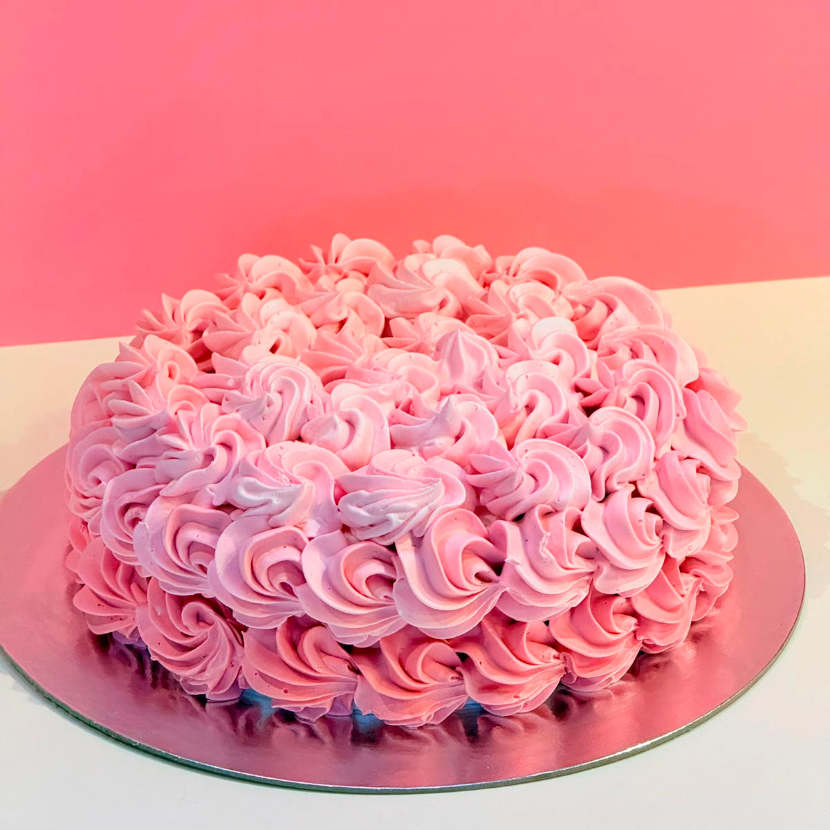 front view of a handcrafted rosette ice cream cake made using Ben & Jerry's ice cream in Adelaide, highlighting its textured floral-inspired finish.
