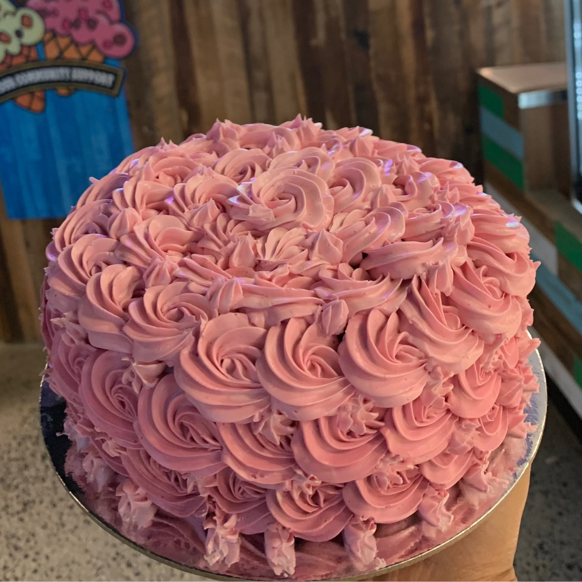 top view of the intricate rosette-inspired piping on a birthday cake handcrafted in Adelaide using Ben & Jerry's ice cream.