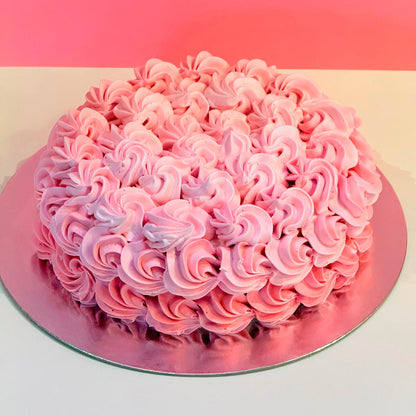 Full view of an elegant rosette birthday cake handcrafted in Adelaide using Ben & Jerry's ice cream, featuring beautiful floral-inspired decorative piping.