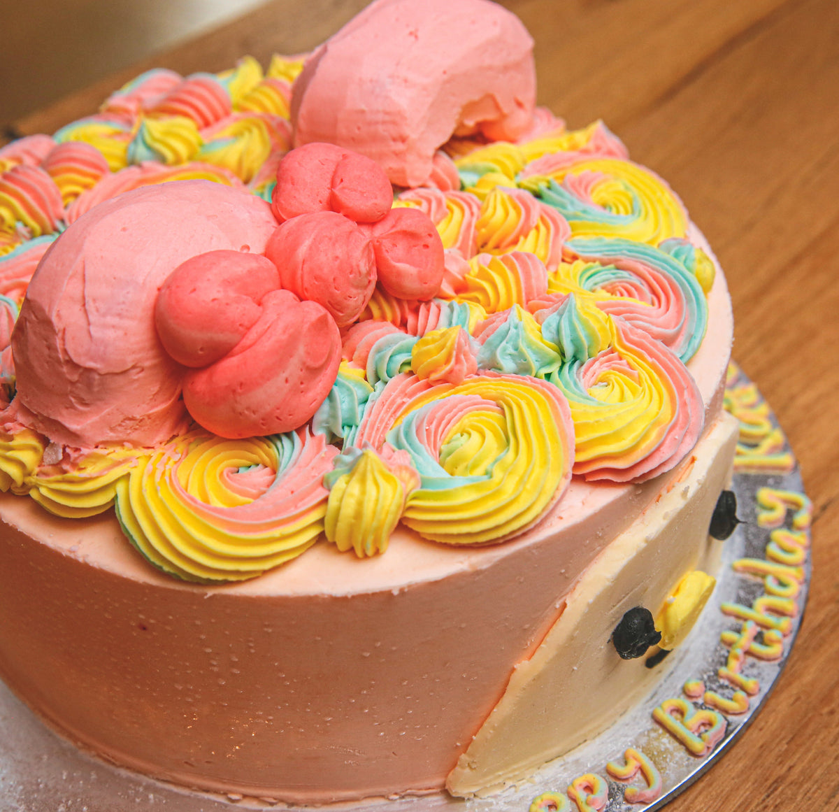 top view of the My Melody character decorations on a handcrafted Sanrio-themed birthday ice cream cake.