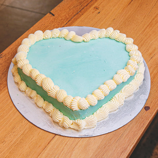 Full view of a simple heart-shaped birthday cake handcrafted in Adelaide using Ben & Jerry's ice cream, featuring a classic minimalist design.