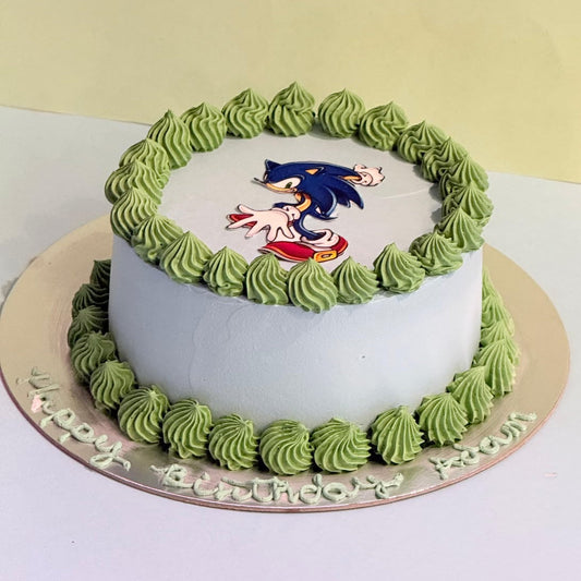 Full view of the Sonic the Hedgehog Ice Cream Cake handcrafted in Adelaide with Ben & Jerry’s ice cream and vibrant blue and green decorations.