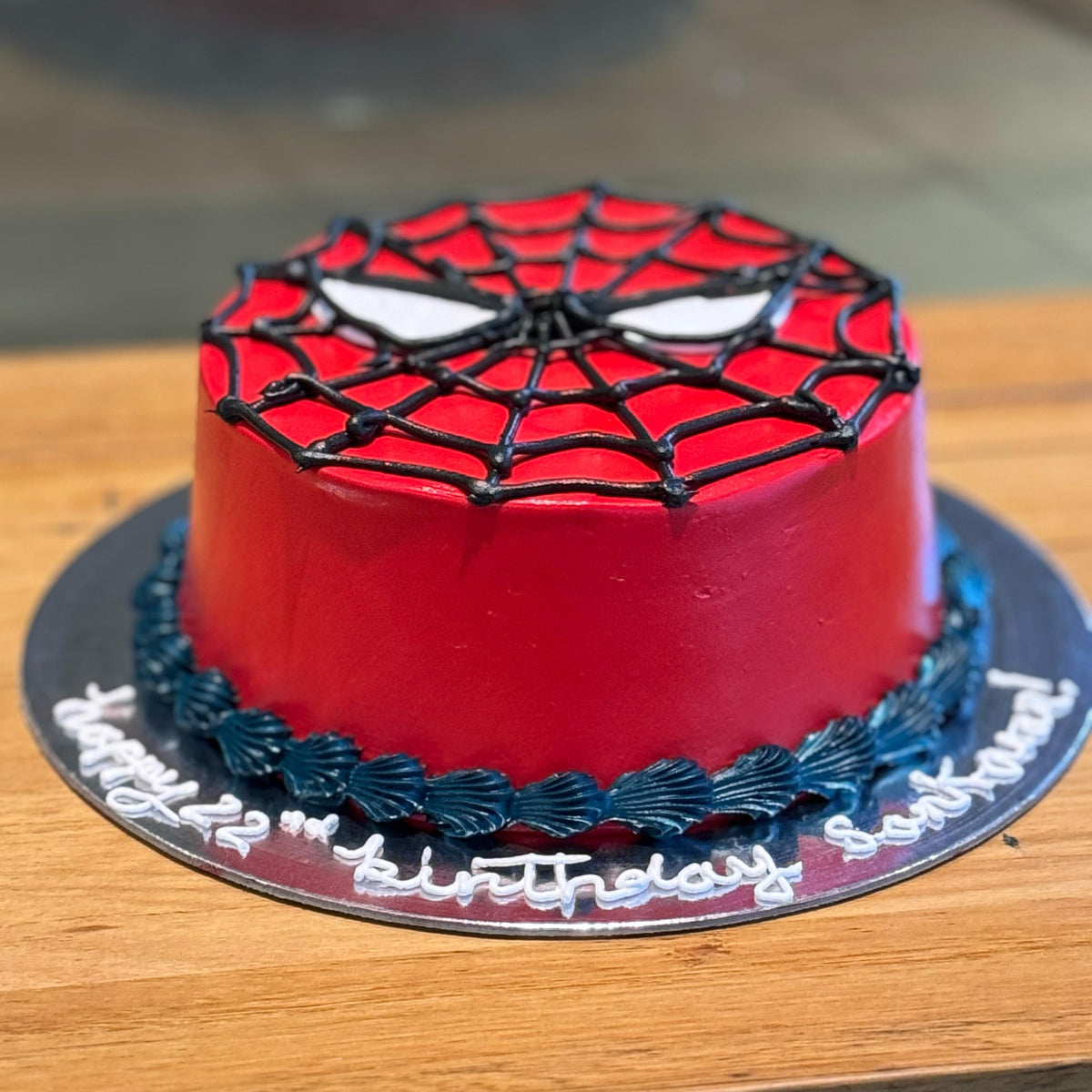 Front view of a Spider-Man birthday cake made with Ben & Jerry's ice cream in Adelaide, showcasing its superhero-inspired presentation.