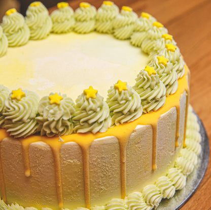 side view of a handcrafted green starry night ice cream cake showcasing its celestial-themed styling and decorative finish.